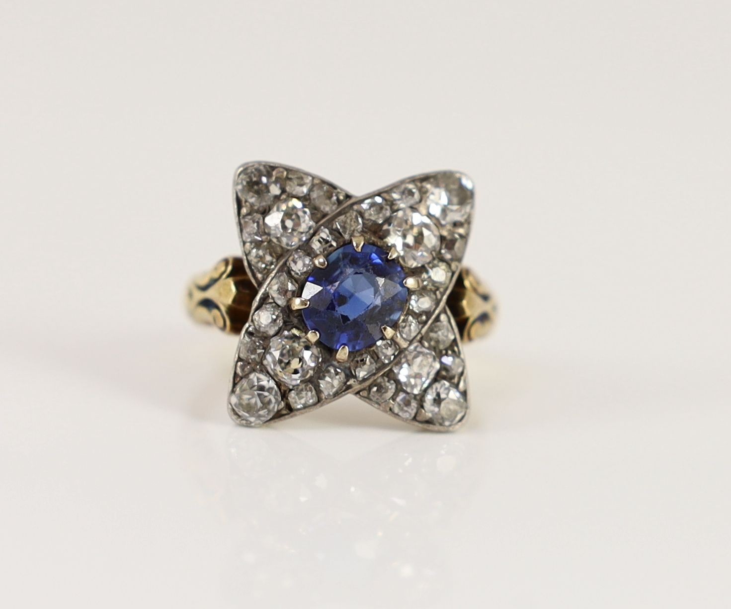 A mid 20th century 18ct gold, sapphire and diamond star shaped cluster dress ring